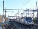 ACS-64 # 645 leads Amtrak Northeast Regional Train # 153 while the first westbound Princeton Dinky of the day proceeds to its platform at PJC 